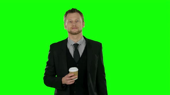 Businessman Walking and Drink Coffee. Green Screen