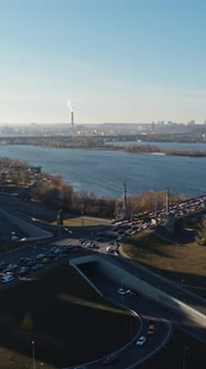 Car Traffic on the Bridge at the Modern City Aerial Vertical View