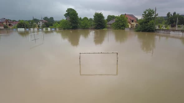 Flooded Soccer Field During a Severe Flood. Aerial Video. From the Water You Can See Only the Top of