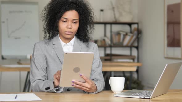 Video Chat on Tablet By African Businesswoman