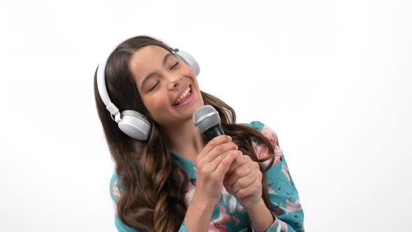 Creative Realisation of Teen Girl in Music Education Listen and Sing in Headphones Vocal School