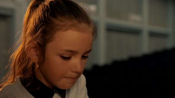 Beautiful teenage girl playing chess. Portrait plan. Close-up