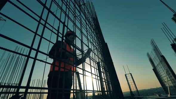 One Construction Worker Knits Steel Reinforcement Rods.