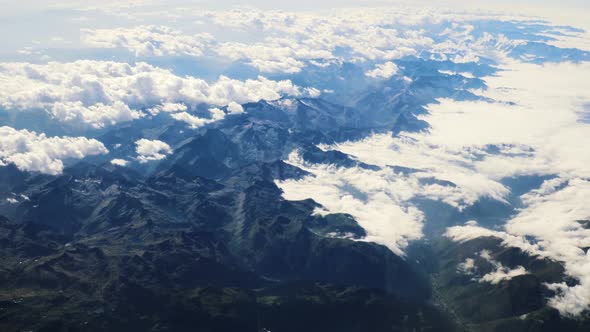 Flying Above the Clouds and the Mountains