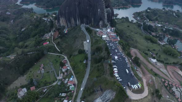 Aerial tilting up on La Pietra, Guatape during evening. Colombia 4k.