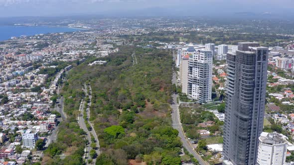 Aerial forward over Avenida Anacaona and coast, Santo Domingo city