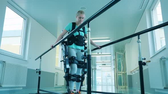 Physiotherapy of a Young Woman Wearing Exoskeleton