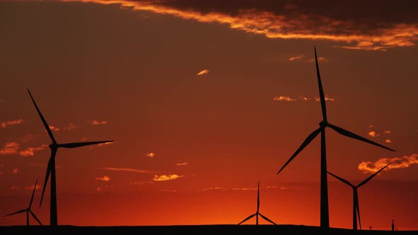 Windmills or Wind Turbine in Sunrise Light