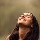 Close-up of a Young Happy Woman with Closed Eyes Enjoying the Warm Summer Rain in the Forest. - VideoHive Item for Sale