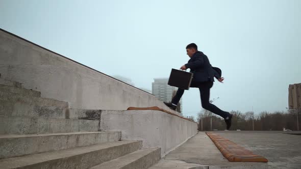 Businessman in Suit Jumps Up Parapets. Career Stairs Concept Corporate Promotion