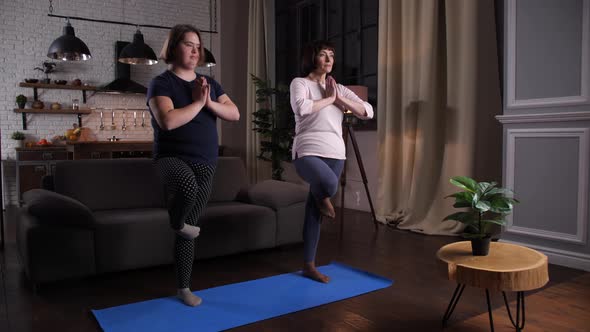 Active Mother and Daughter Training Yoga Pose
