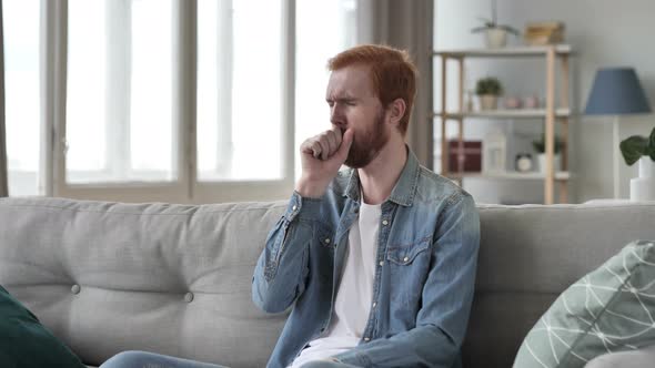 Coughing Beard Man Sitting in Creative Room