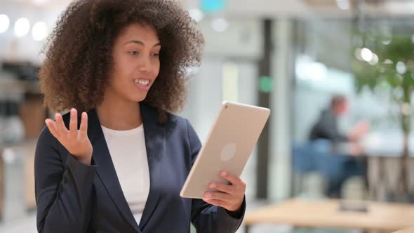 African Businesswoman Talking for Video Chat on Tablet 