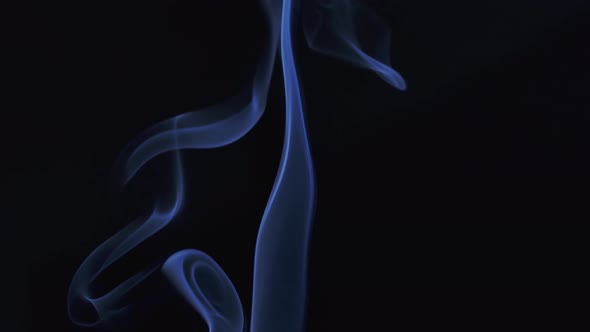 Abstract Smoke Cloud. Blue Smoke Slowly Floating Through Space Against Black Background. Close Up