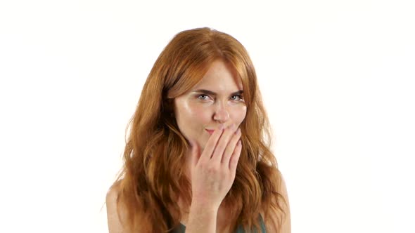 Girl Is Making Faces and Fooling Around. White Background