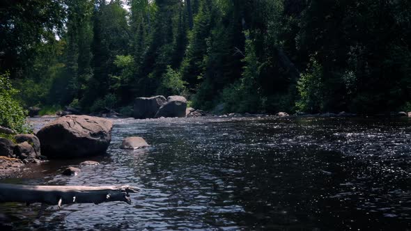 The Baptism River flowing through Tettegouche State Park Minnesota. The relaxing forest and calm flo