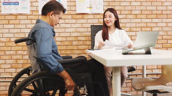 Businesspeople smiling coworking and showing growth graphic and taking a business