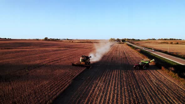 Soybean harvest in the midwest from a drone with a New Holland combine.