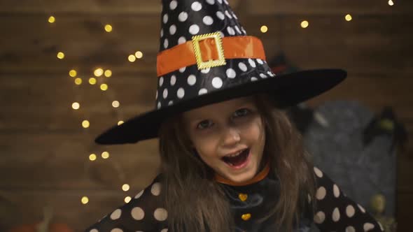 Little Girl Child In Witch Costume For Halloween Holiday