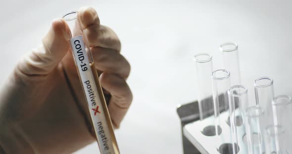 Doctor holding a coronavirus COVID-19 test tube