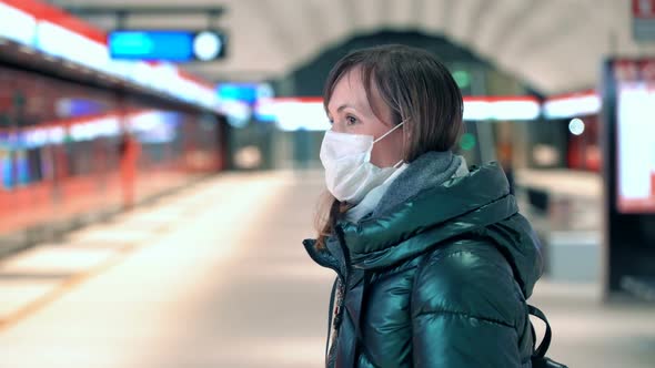 Young Woman in Protective Sterile Medical Face Mask at a Metro Station