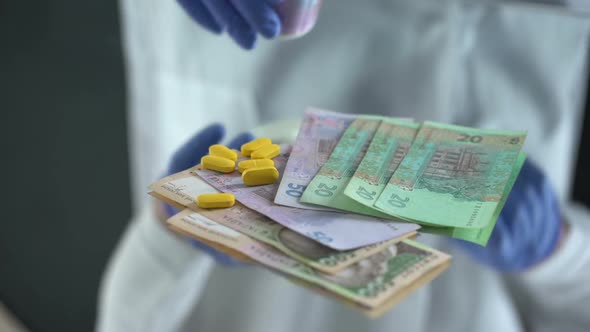 Pharmacist Dropping Pills on Hryvnias, Expensive Medical Treatments in Ukraine