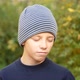 Serious Boy in Striped Hat Standing in Park Looks at Camera and Nods His Head in Disagreement - VideoHive Item for Sale
