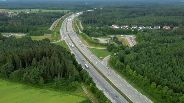 Aerial view of the highway near Munich. Cars and trucks use the junction to transport production goo