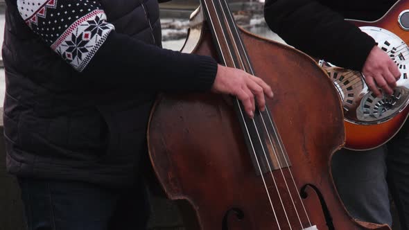 Unidentified Street Musicians Play Jazz and Folk Music on Charles Bridge in Prague Czech Republic