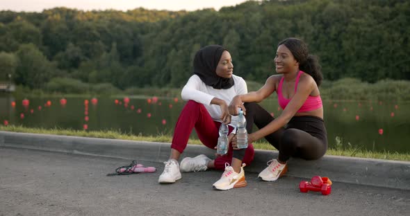 Black Female Friends Having a Rest After Jogging