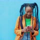 Portrait of woman with long black braids holding smart phone, Milan, Italy - VideoHive Item for Sale