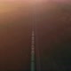 Freight train moving through the foggy forest at sunrise. Aerial view. - VideoHive Item for Sale
