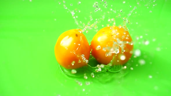 Falling of Tomatoes in Water