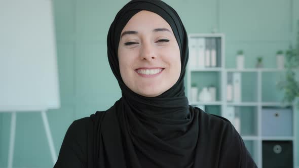 Female Happy Face Closeup Portrait Indoors Islamic Muslim Arabian Woman Girl in Black Hijab Nods