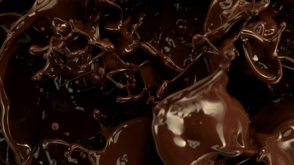 Super Slow Motion Shot of Splashing Melted Chocolate Background at 1000 Fps
