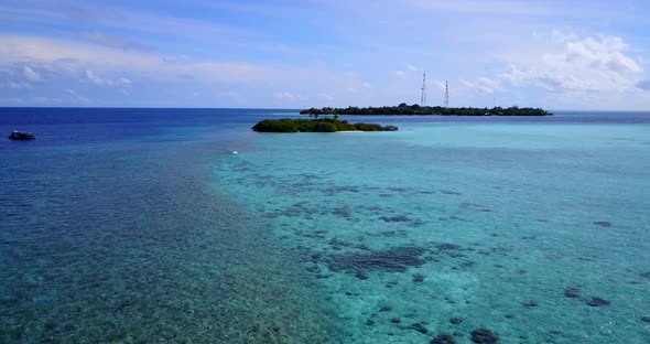 Beautiful above tourism shot of a paradise sunny white sand beach and blue water background 