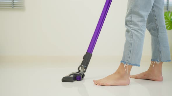 Close up of cleaning service woman worker clean living room at home.