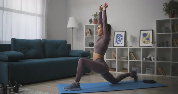 Slender Lady Is Stretching Body During Daily Workout at Home Prevention of Osteochondral Disease