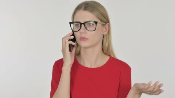 Young Woman Talking Angry on Phone on White Background