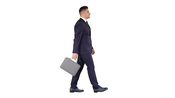 Handsome Businessman in A Suit Walks with A Briefcase On