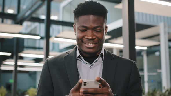 Smiling Happy African Man Office Manager Boss Worker American Guy Male Businessman Hold Smartphone