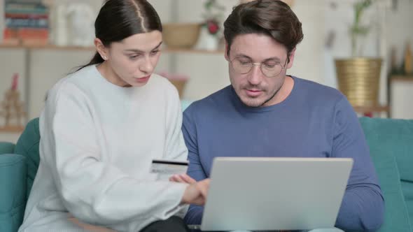 Successful Online Shopping on Laptop By Hispanic Couple