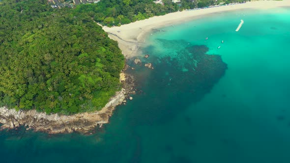 Nice rocks forested island, aerial panorama of Ko Pu against mountainous Phuket landscape on backgro