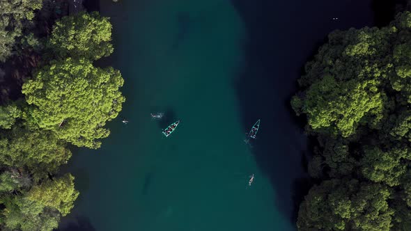 AERIAL: Lago De Camecuaro, Boat, Swimmer, Tangancicuaro, Mexico (Descending Down)
