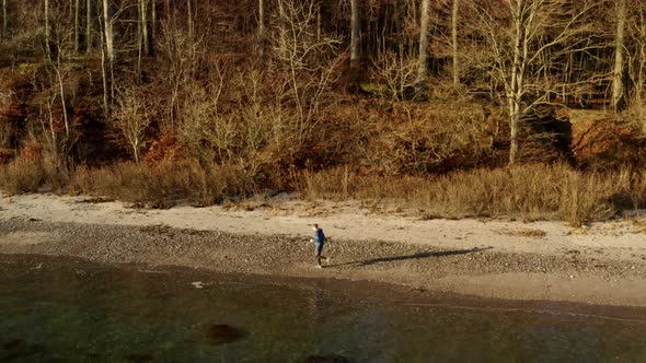 Young Man Jogging in the Beach in Denmark