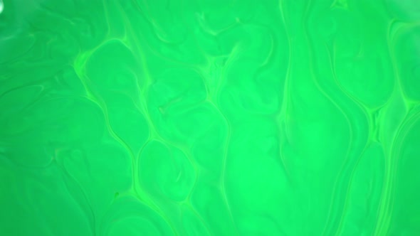  Footage. Ink in Water. Green Ink Reacting in Water Creating Abstract Background