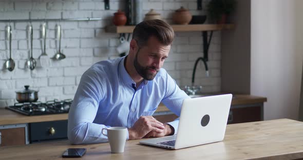 Upset Businessman Feel Annoyed After Online Conferension Looking in Laptop