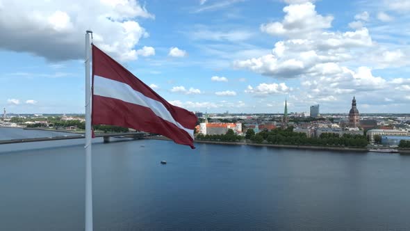 Latvian Flag with the Dome Cathedral and an Old Town in the Background in Riga Latvia