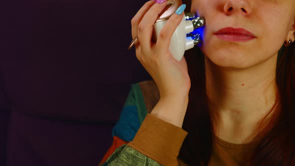 Part of Woman's Face with Face Massager