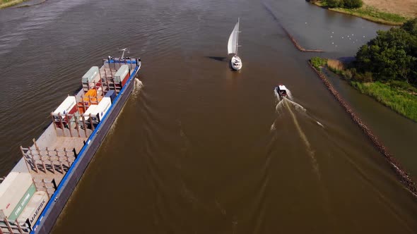 Yacht, Sailboat And Barge With Shipping Container Sailing Across The Oude Maas In Netherlands. - aer